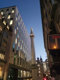 Low angle view of skyscrapers against clear sky