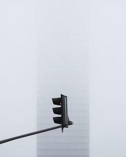 Low angle view of illuminated light against building