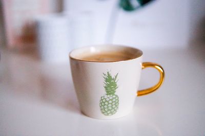 Close-up of coffee cup on table