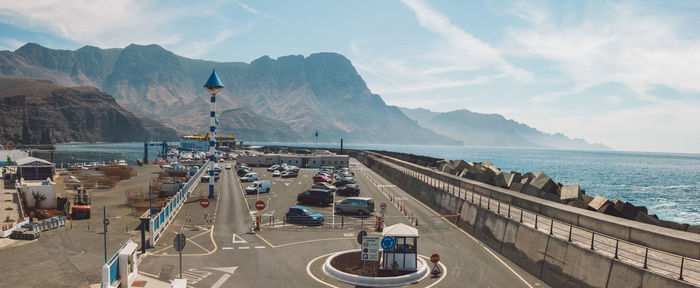 High angle view of road by sea against sky