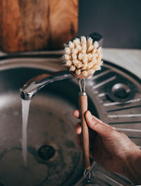 Dishwashing brush in the hand