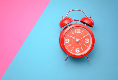 Close-up of clock against blue background