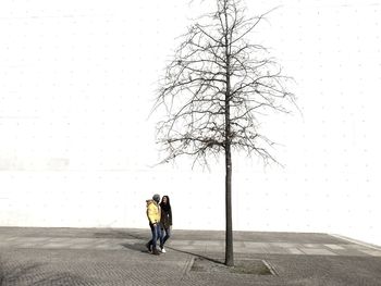 Woman standing on road