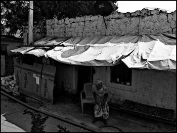 People sitting on built structure