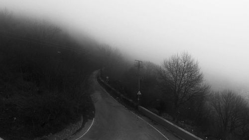 Road passing through foggy weather