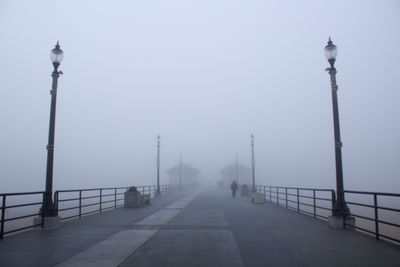 Bridge against sky during foggy weather