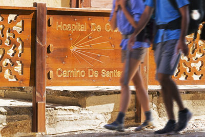 Way of st james to compostela , pilgrims in motion with backpack in hospital of orbigo