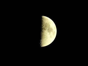 Low angle view of moon against clear sky at night