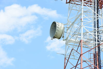 Low angle view of communications tower against sky