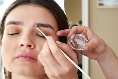 Woman getting eyebrows done