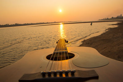 Scenic view of sea against sky during sunset