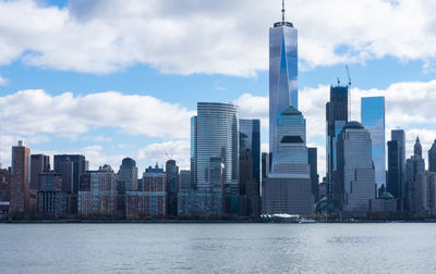 New york city by sea against sky in city