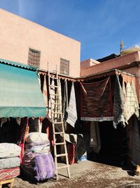 Rear view of clothes drying against building