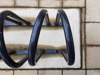 High angle view of metal hanging on wall