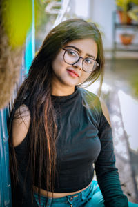 Portrait of beautiful young woman wearing eyeglasses