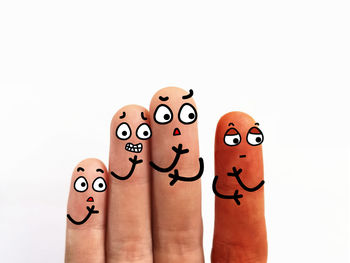 Close-up of human hand against white background