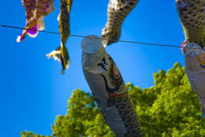 Low angle view of man standing against clear sky