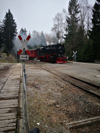 Train on railroad track against sky