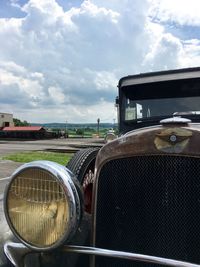 Close-up of car against sky