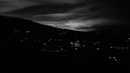 Scenic view of mountains against sky at night