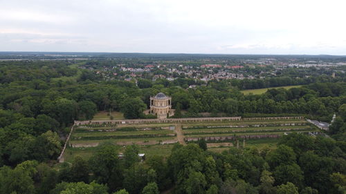 High angle view of trees and buildings against sky