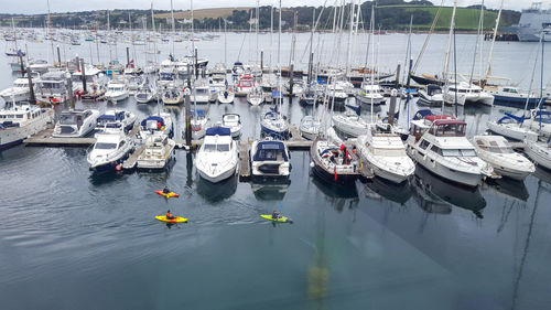 High angle view of boats moored at harbor