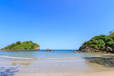 Scenic view of sea against clear blue sky