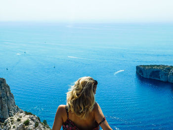 Rear view of woman looking at sea