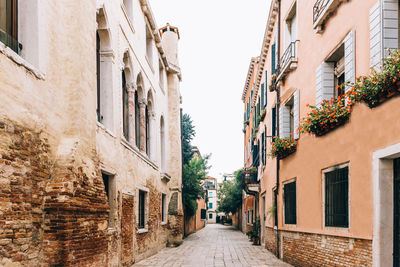 Narrow street amidst buildings in town