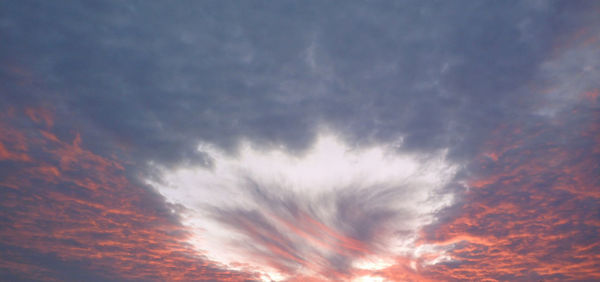 Low angle view of dramatic sky during sunset