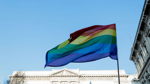 Low angle view of flag against clear sky