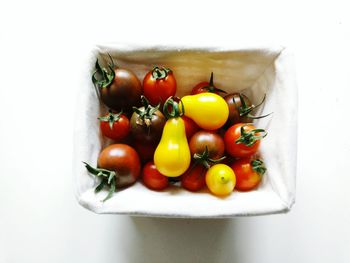 Close-up of fruit over white background