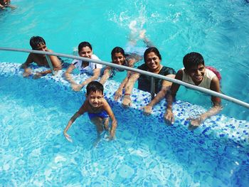 High angle view of people swimming in pool