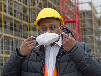 Portrait of man standing in city