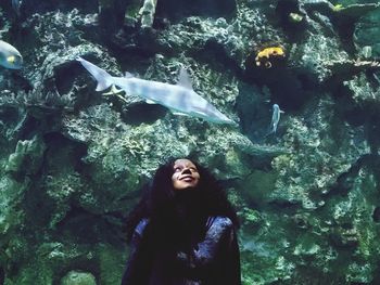 Young woman in aquarium