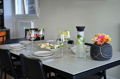 Plates and glasses for cocktail on a table at home