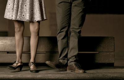 Low section of people standing at home