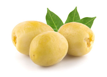 Close-up of oranges against white background