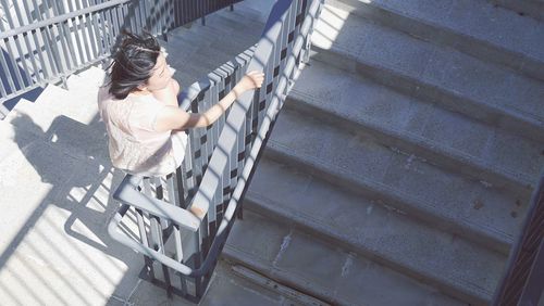 High angle view of boy on steps