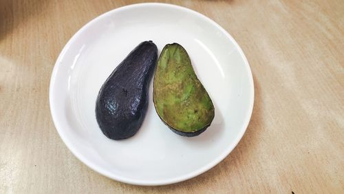 High angle view of fruits in plate on table