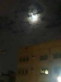 Low angle view of building against sky at night