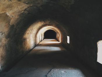 Empty walkway in tunnel