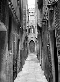 Narrow alley amidst buildings in city