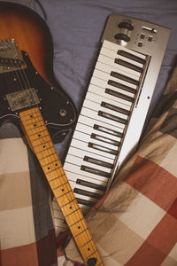 High angle view of guitar at home