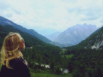 Woman looking at mountains in kranjska gora