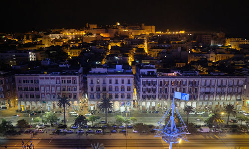 Aerial view by night of cagliari city - aug 2021 italy - view from above sardinia