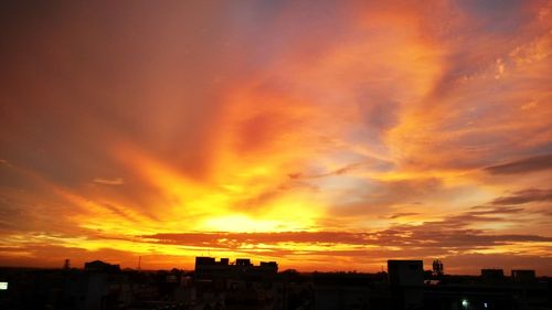 Silhouette of buildings at sunset
