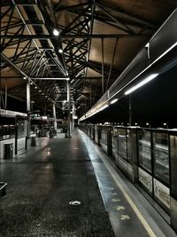 Empty railroad station platform at night