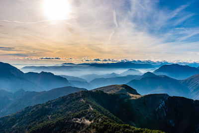 Scenic view of mountains against sky during sunset