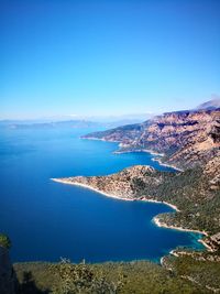 High angle view of sea against clear blue sky